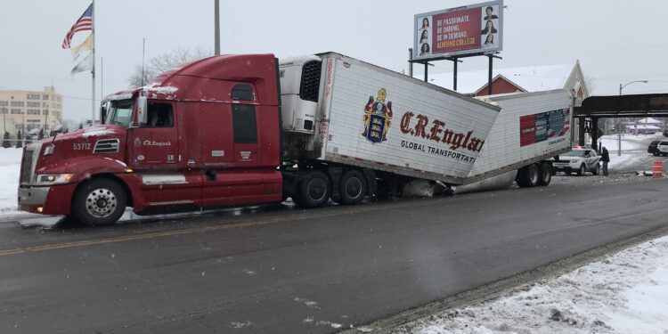 Potato truck crushed after drive under bridge