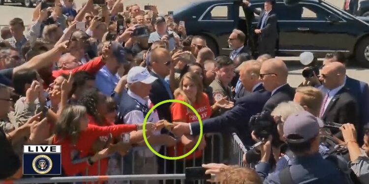 President Trump autographs woman’s shoe