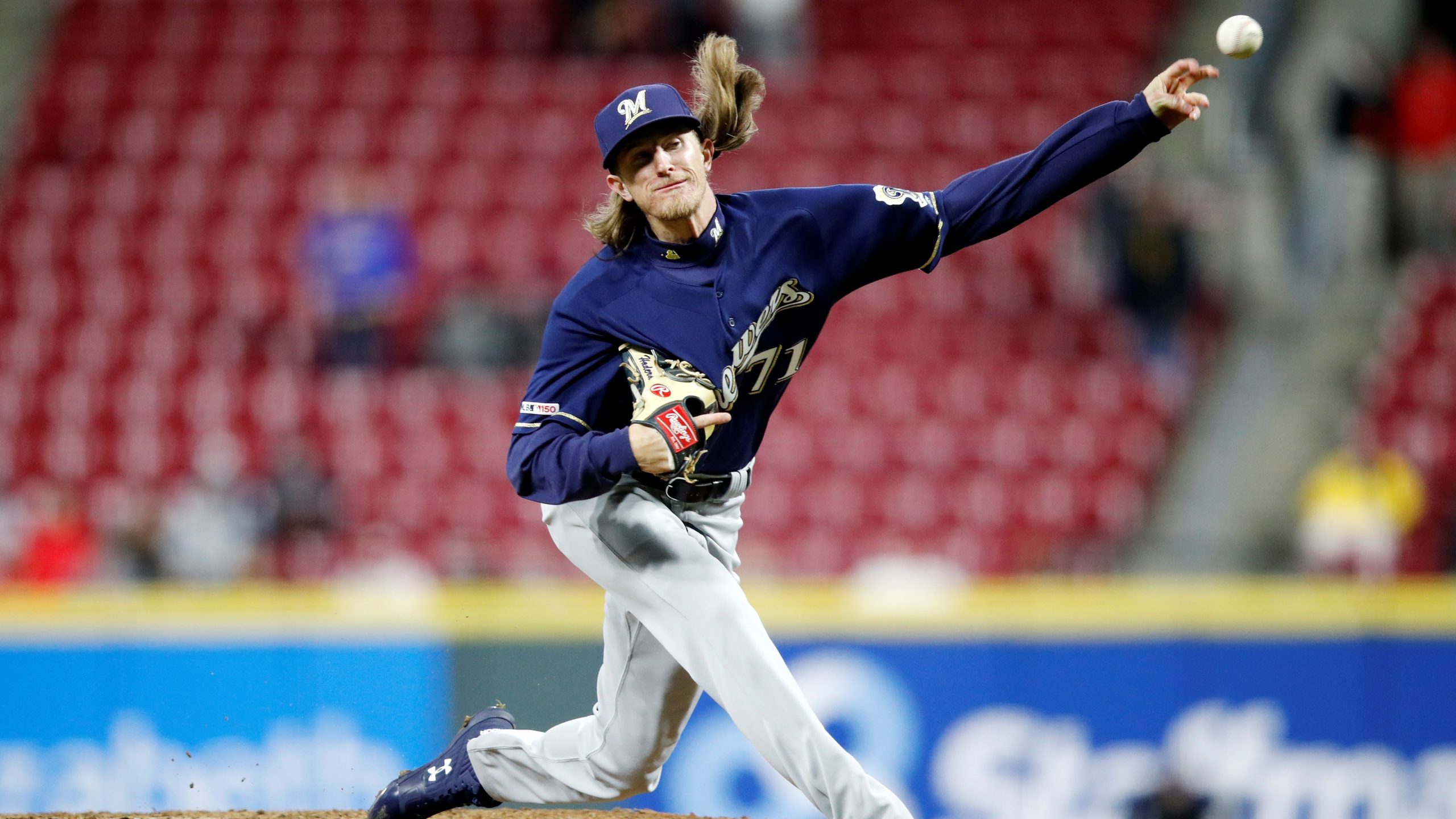 Brewers win first game over Reds 4-3