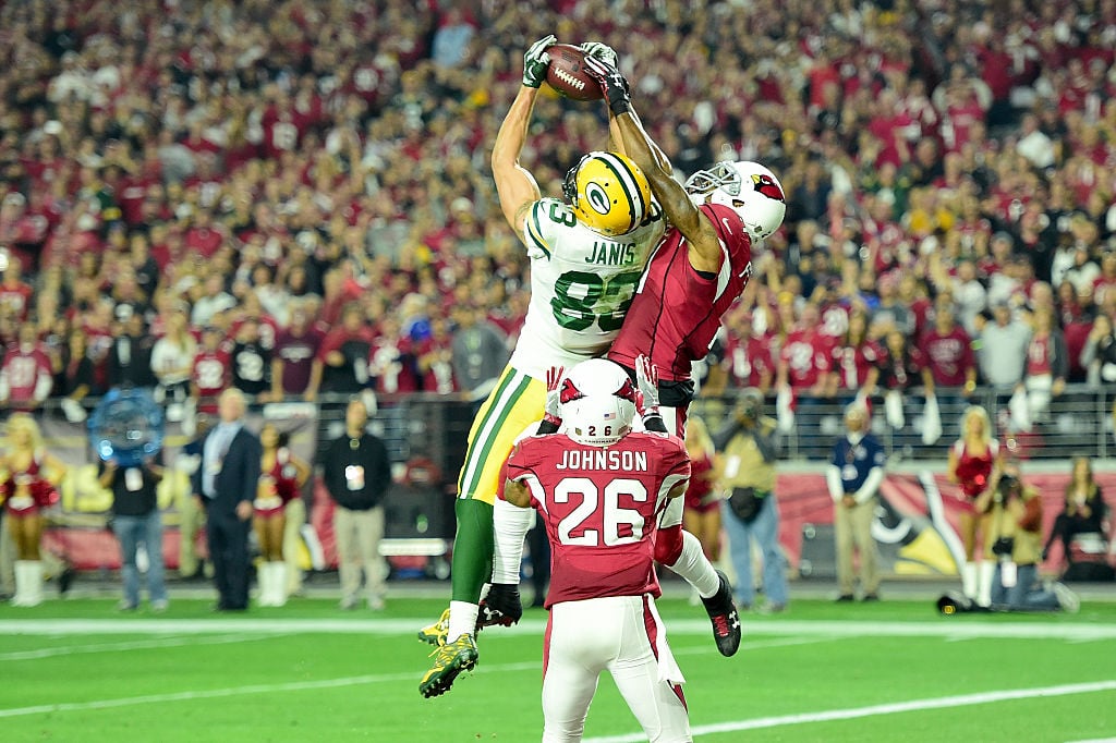 Two Hail Marys answered, but not enough for victory. Aaron Rodgers and Jeff Janis combined to complete two Hail Mary throws on the Packers' final drive of their divisional playoff against the Arizona Cardinals. One was a fourth-down throw. The other reached the end zone at the final gun to tie the game at 20. But the Packers wouldn't touch the ball again, as Arizona's Larry Fitzgerald touched it twice and took care of all 80 yards on the first drive of overtime to beat Green Bay 26-20. (Photo by Harry How/Getty Images)