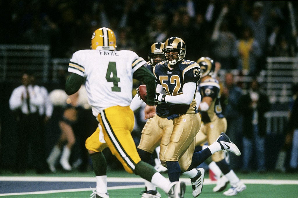 Brett Favre just threw another interception. That phrase was uttered too many times for Packers fans' liking in the 2001 NFC Divisional Playoff. Favre threw six of those interceptions in the St. Louis Rams' 45-17 blowout of the Packers. (Photo by James V. Biever/Getty Images)