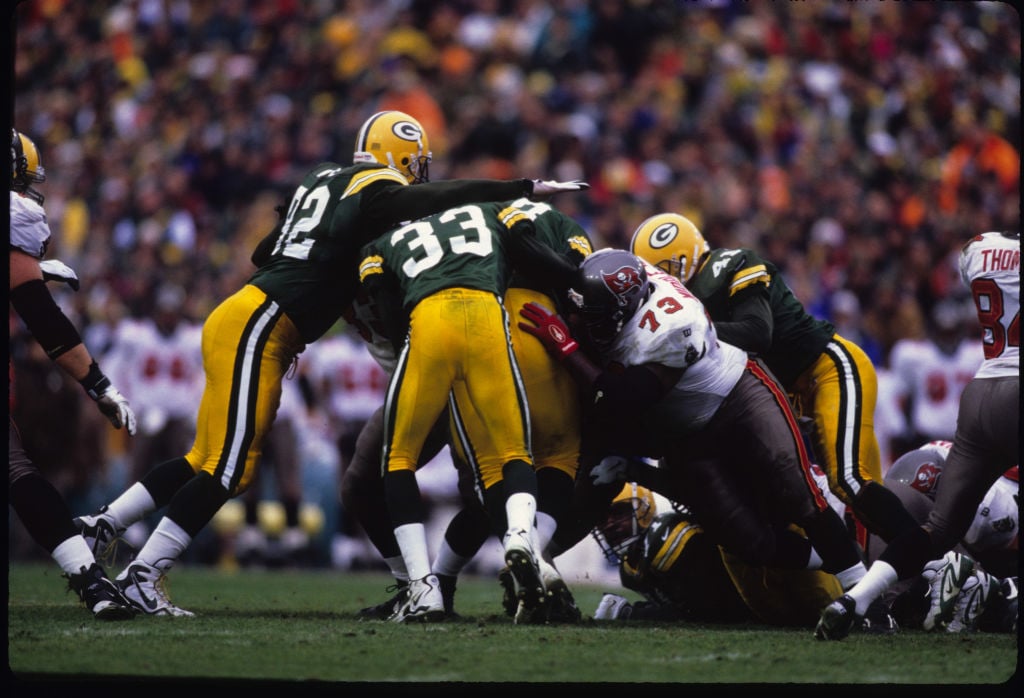 Defense. The theme of the day in chilly Green Bay when the Packers hosted the up-and-coming Tampa Bay Buccaneers in the 1997 NFC Divisional Playoff. Reggie White and company held Tampa Bay to just 290 total yards and forced two interceptions in a 21-7 win. (Photo by Allen Kee/Getty Images)