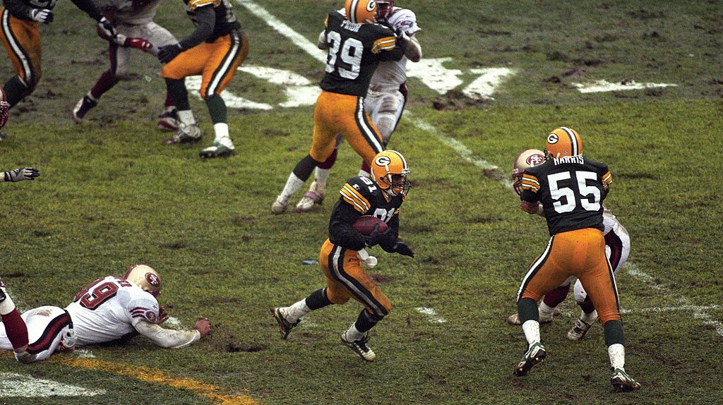 "Suddenly, the Packers lead!" The words of Jim Irwin after Desmond Howard took the first touch of the football for the Packers 71 yards for a punt return touchdown. He had 144 punt return yards in the first quarter alone in a 3-14 triumph over San Francisco to kick off the 1996 Packers run to a win in Super Bowl XXXI. (Photo by Ronald C. Modra/Getty Images)