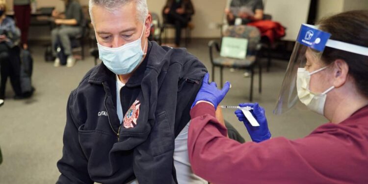 Local government frontline workers begin receiving COVID-19 vaccine