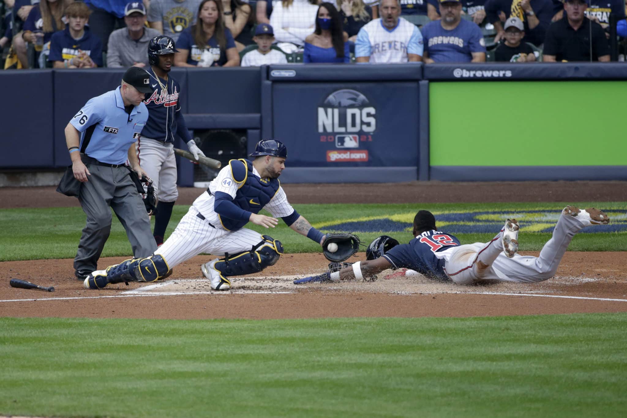 Manny Pina of the Milwaukee Brewers tries to rip off the shirt of News  Photo - Getty Images