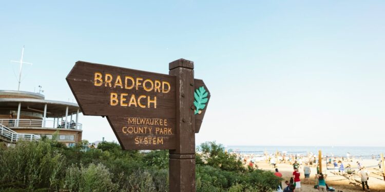 A wooden sign for Bradford Beach in Milwaukee