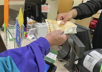 Ticket sales jump as Powerball jackpot balloons