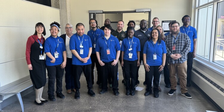 Project SEARCH student interns take picture with state legislatures before the tour