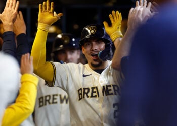 MILWAUKEE, WISCONSIN - APRIL 30: Willy Adames #27 of the Milwaukee Brewers is congratulated after hitting a three run homer during the game against the Tampa Bay Rays at American Family Field on April 30, 2024 in Milwaukee, Wisconsin. (Photo by John Fisher/Getty Images)
