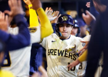 MILWAUKEE, WISCONSIN - MAY 14: Sal Frelick #10 of the Milwaukee Brewers is congratulated after hitting a two-run home run during the second inning against the Pittsburgh Pirates at American Family Field on May 14, 2024 in Milwaukee, Wisconsin. (Photo by John Fisher/Getty Images)