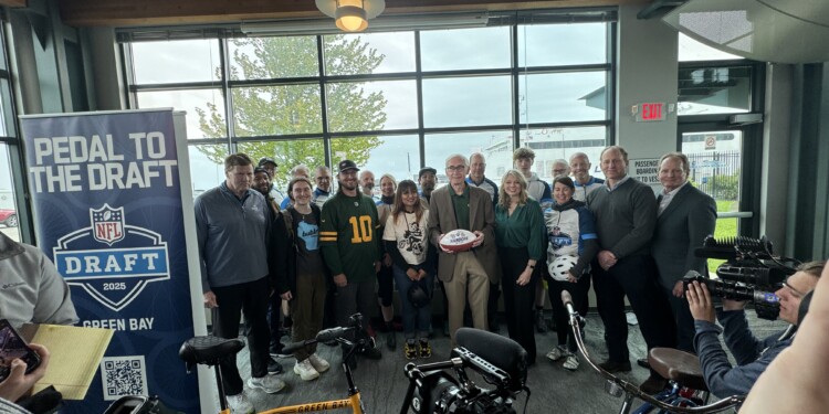 Governor Tony Evers & Packers President & CEO Mark Murphy with the cyclists for the Pedal to the Draft