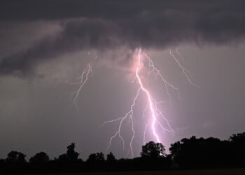 Lightning strikes over the countryside during a thunderstorm following high temperatures on July 10, 2024 near Potsdam, eastern Germany. (Photo by RALF HIRSCHBERGER / AFP) (Photo by RALF HIRSCHBERGER/AFP via Getty Images)