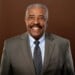 A headshot of former city attorney Tearman Spencer