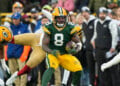 GREEN BAY, WISCONSIN - NOVEMBER 24: Running back Josh Jacobs #8 of the Green Bay Packers runs the ball during the first half of an NFL football game against the San Francisco 49ers at Lambeau Field on November 24, 2024 in Green Bay, Wisconsin. (Photo by Todd Rosenberg/Getty Images)