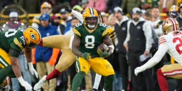GREEN BAY, WISCONSIN - NOVEMBER 24: Running back Josh Jacobs #8 of the Green Bay Packers runs the ball during the first half of an NFL football game against the San Francisco 49ers at Lambeau Field on November 24, 2024 in Green Bay, Wisconsin. (Photo by Todd Rosenberg/Getty Images)
