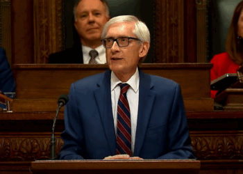 Wisconsin’s Evers calls for gun control measures and a bipartisan approach to immigration