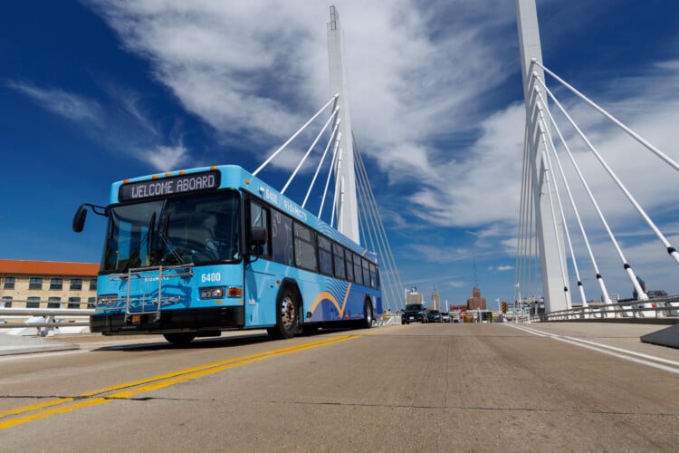 A Milwaukee County Transit System bus drives on 6th Street in Milwaukee. Image Credit: Milwaukee County Transit System