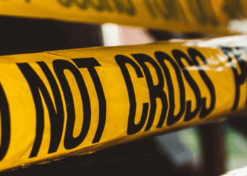 Police "Do Not Cross" crime tape. Photo by David von Diemar on Unsplash.