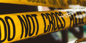 Police "Do Not Cross" crime tape. Photo by David von Diemar on Unsplash.