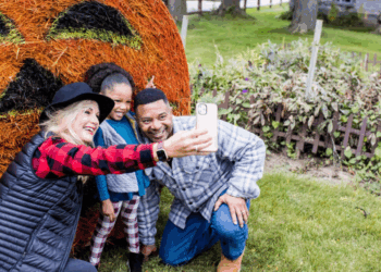 Family Takes A Selfie With Halloween Decor At The Swiss Historical Village Museum In New Glarus (Photo: Travel Wisconsin)