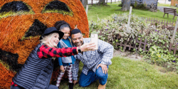 Family Takes A Selfie With Halloween Decor At The Swiss Historical Village Museum In New Glarus (Photo: Travel Wisconsin)