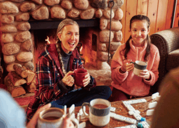 Family plays dominoes in a lodge in Woodruff, WI (Photo: Travel Wisconsin)