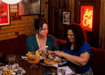 Couple enjoys a meal at the Safe House in Milwaukee (Photo: Travel Wisconsin)