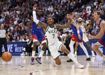 DENVER, COLORADO - JANUARY 11: Kevin Porter Jr. #7 of the Milwaukee Bucks reacts after a loose ball during the second quarter against the Denver Nuggets at Ball Arena on January 11, 2026 in Denver, Colorado. NOTE TO USER: User expressly acknowledges and agrees that, by downloading and or using this photograph, User is consenting to the terms and conditions of the Getty Images License Agreement. (Photo by Tanner Pearson/Clarkson Creative/Getty Images)