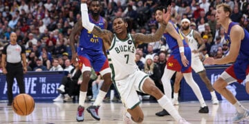 DENVER, COLORADO - JANUARY 11: Kevin Porter Jr. #7 of the Milwaukee Bucks reacts after a loose ball during the second quarter against the Denver Nuggets at Ball Arena on January 11, 2026 in Denver, Colorado. NOTE TO USER: User expressly acknowledges and agrees that, by downloading and or using this photograph, User is consenting to the terms and conditions of the Getty Images License Agreement. (Photo by Tanner Pearson/Clarkson Creative/Getty Images)