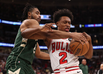 CHICAGO, ILLINOIS - MARCH 1: Collin Sexton #2 of the Chicago Bulls and Cam Thomas #24 of the Milwaukee Bucks fight for a loose ball during the first half at the United Center on March 1, 2026 in Chicago, Illinois. NOTE TO USER: User expressly acknowledges and agrees that, by downloading and or using this photograph, User is consenting to the terms and conditions of the Getty Images License Agreement. (Photo by Geoff Stellfox/Getty Images)