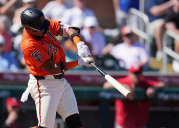 San Francisco Giants' Luis Matos connects for a run-scoring double against the Cincinnati Reds during the second inning of a spring training baseball game Friday, March 6, 2026, in Scottsdale, Ariz. (AP Photo/Ross D. Franklin)