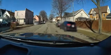 Newly released body cam footage shows officer clinging to truck before shooting