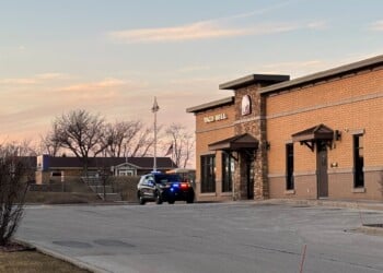 A Taco Bell employee is in custody after a fight involving gunfire in Muskego.