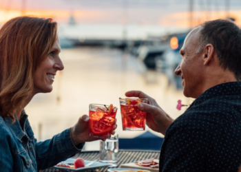 Couple Enjoys Waterfront Dining At Sonny's Pizzeria In Door County (Photo: Travel Wisconsin)
