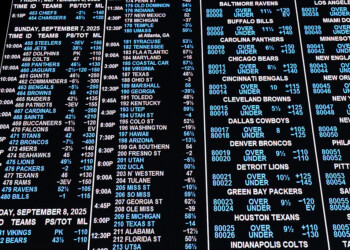 Governor Tony Evers signs online sports betting bill while expressing concerns