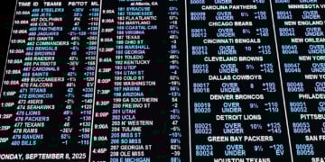 Governor Tony Evers signs online sports betting bill while expressing concerns