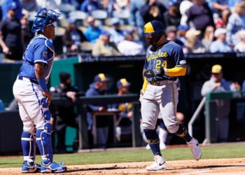 KANSAS CITY, MO - APRIL 05: Milwaukee Brewers catcher William Contreras (24) crosses the plate to score in from of Kansas City Royals catcher Salvador Perez (13) on April 5th, 2026 at Kauffman Stadium in Kansas City, Missouri. (Photo by William Purnell/Icon Sportswire via Getty Images)