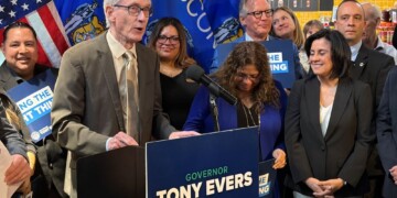 Governor Tony Evers takes action on Assembly Bill 759 during a bill signing ceremony Thursday in Milwaukee. (Neil Doyle/WTMJ)