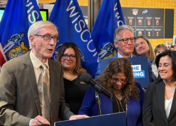 Governor Tony Evers takes action on Assembly Bill 759 during a bill signing ceremony Thursday in Milwaukee. (Neil Doyle/WTMJ)