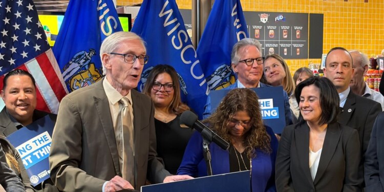 Governor Tony Evers takes action on Assembly Bill 759 during a bill signing ceremony Thursday in Milwaukee. (Neil Doyle/WTMJ)