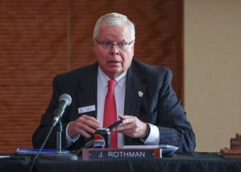 FILE - University of Wisconsin System President Jay Rothman prepares his materials before a UW Board of Regents meeting on Sept. 18, 2025, at Gordon Commons at UW-Madison in Madison, Wis. (Owen Ziliak/Wisconsin State Journal via AP, File)