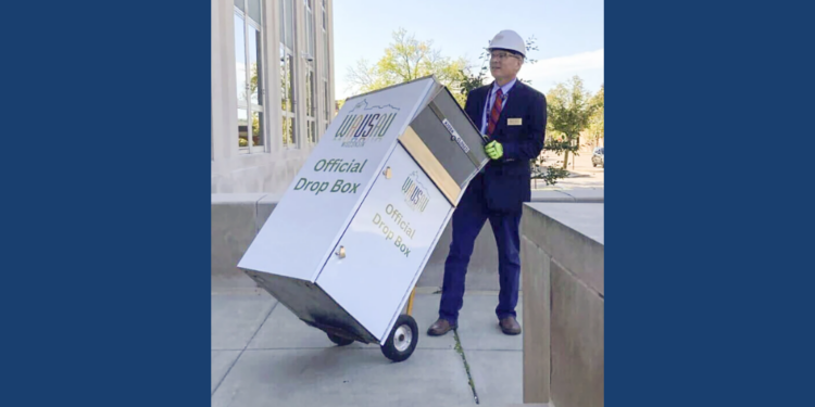 Wausau Mayor Doug Diny removing the ballot drop box in 2024.
