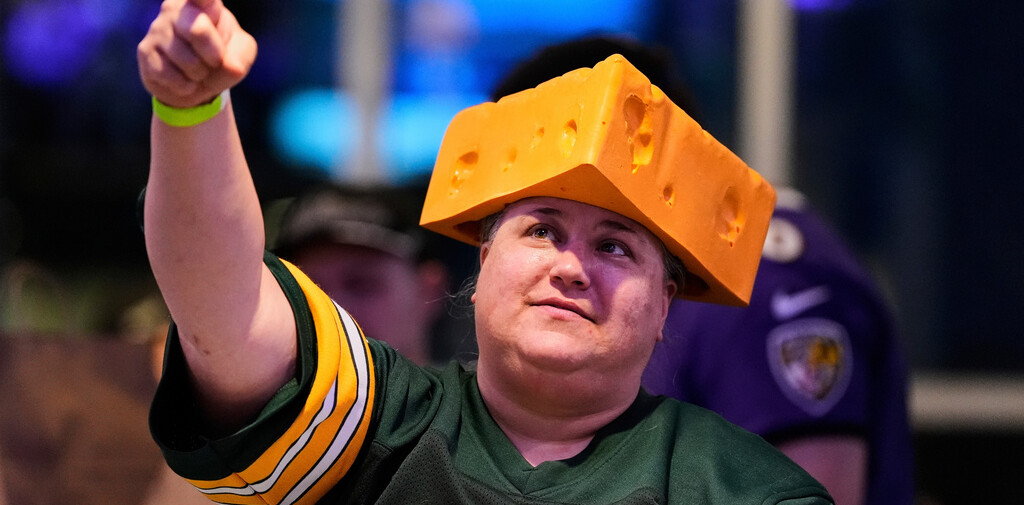 The cheesehead hat is a sunny nod to America’s ‘Hold my beer ...