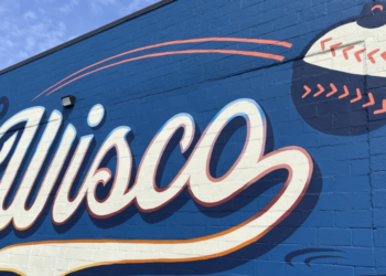The new Brewers mural "The Launch" on Slingshot Bar exterior.