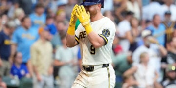 Jake Bauers covers face while heading back to dugout after hitting home run at American Family Field.