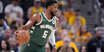 Milwaukee Bucks’ Malik Beasley dribbles during the first half of Game 4 of the first round NBA playoff basketball series against the Indiana Pacers, April 28, 2024, in Indianapolis. (AP Photo/Michael Conroy, file)