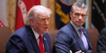 President Donald Trump speaks during a Cabinet meeting at the White House, Wednesday, May 27, 2026, in Washington, as Secretary of Defense Pete Hegseth, looks on. (AP Photo/Jacquelyn Martin)