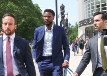 Former NBA player Malik Beasley, center, exits Brooklyn federal court, Wednesday, July 1, 2026, in New York. (AP Photo/Heather Khalifa)