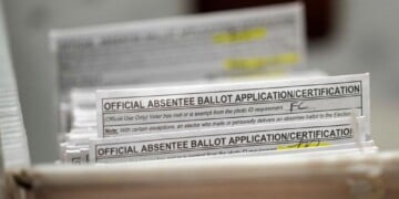 FILE - Absentee ballots during a count at the Wisconsin Center, Nov. 8, 2022, in Milwaukee. (AP Photo/Morry Gash, File)