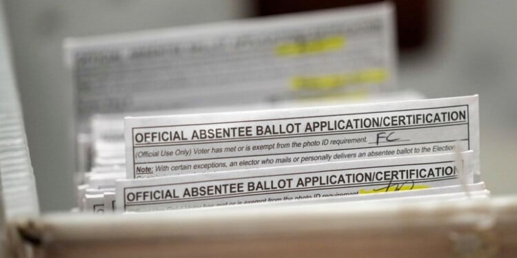FILE - Absentee ballots during a count at the Wisconsin Center, Nov. 8, 2022, in Milwaukee. (AP Photo/Morry Gash, File)